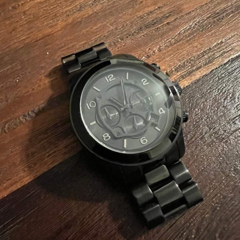 Vintage black metal Michael Kors Watch.